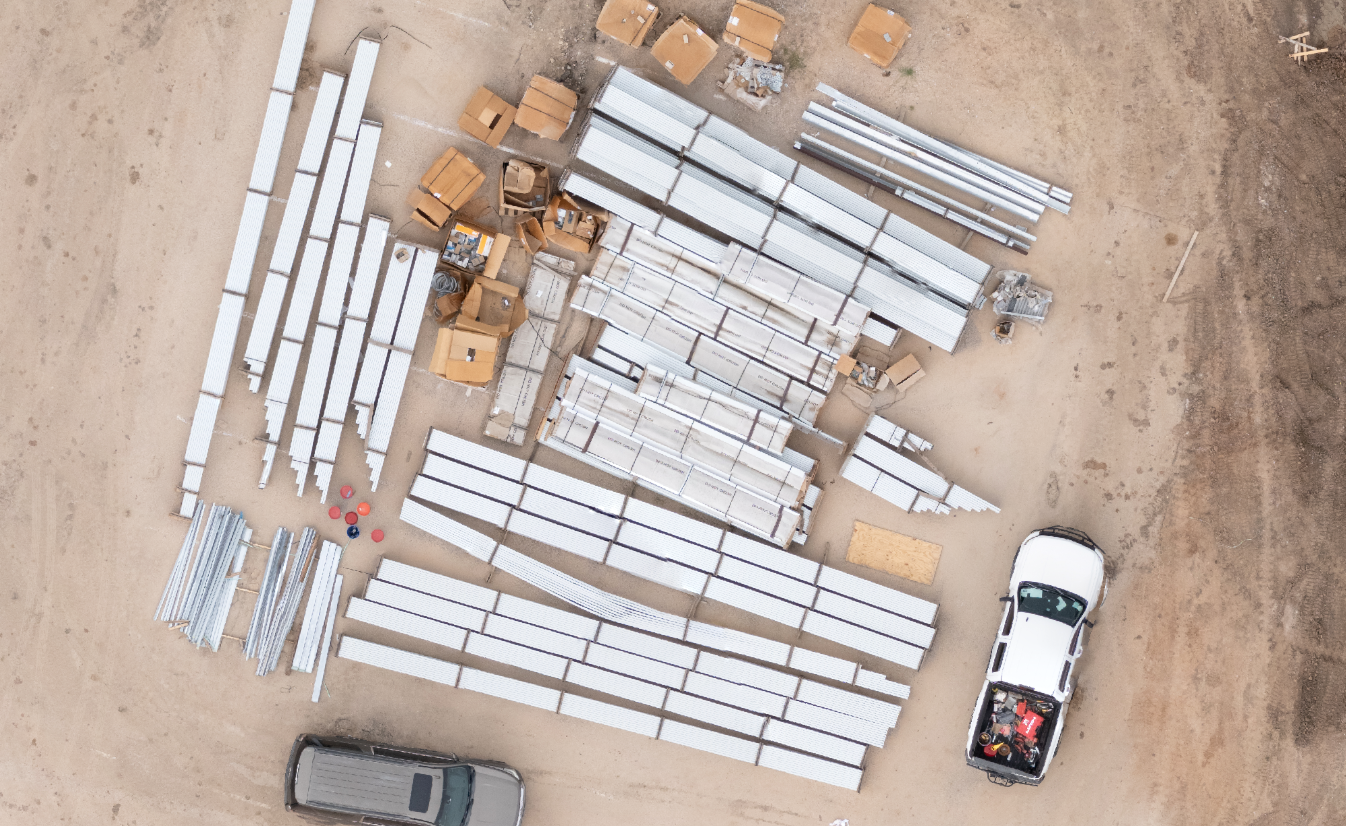 Top-down drone image showing construction material staging