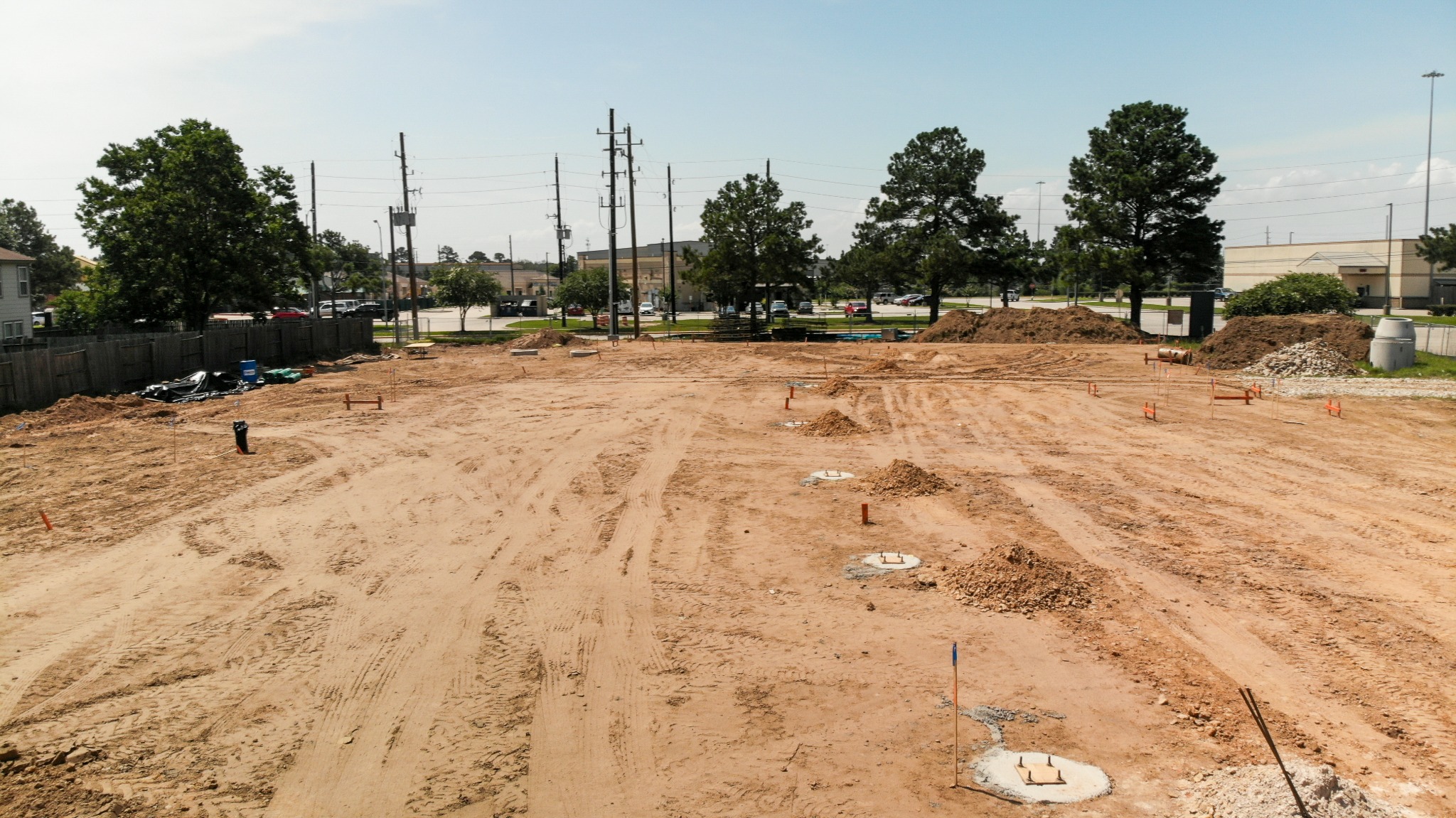 Early-stage commercial construction site with site work underway